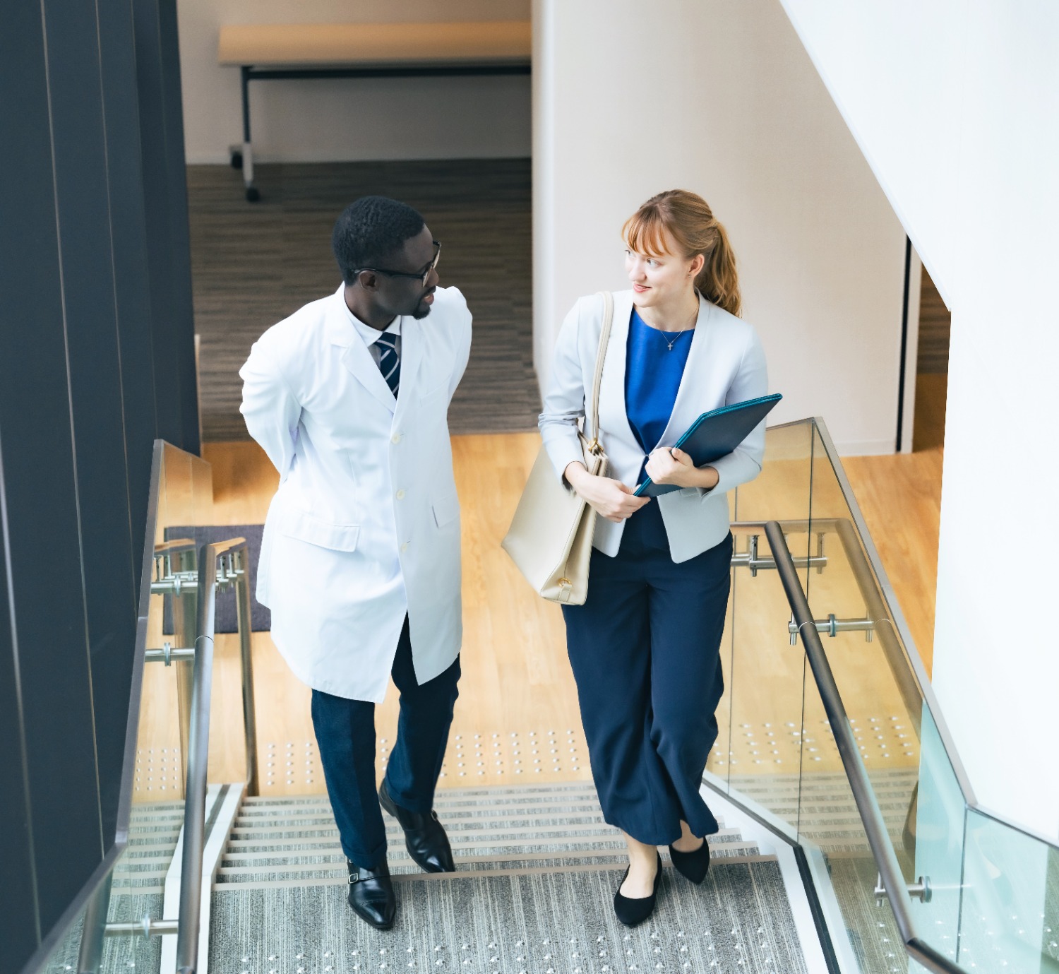 FranU professionals walking up stairs